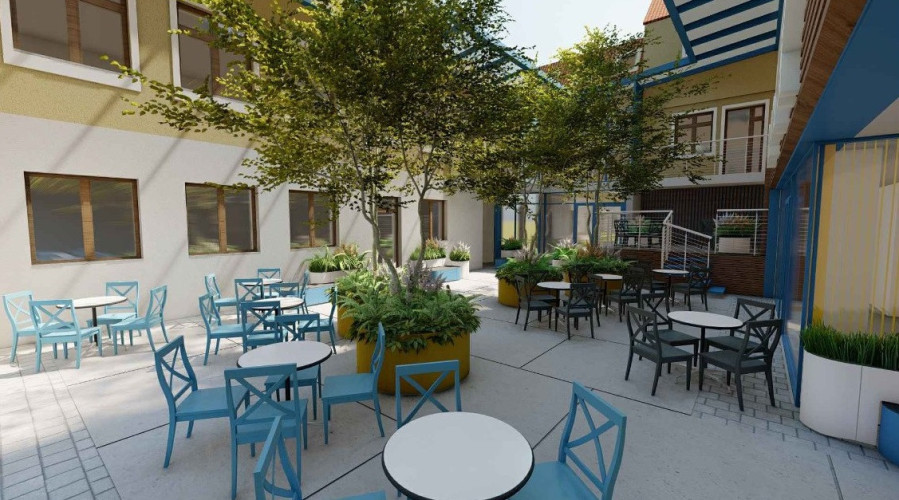 Květináče s lavicí ve veřejném atriu